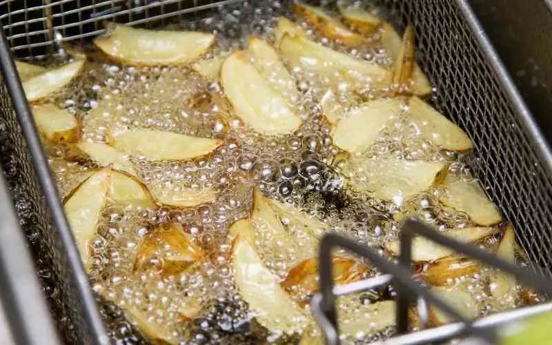 potatoes frying in the oil